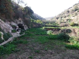 The valley with the trench on the left side.