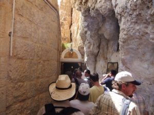 The main corridor of the Cartanel: On one side the rock and on the other doors to rooms of pilgrims who want to meditate