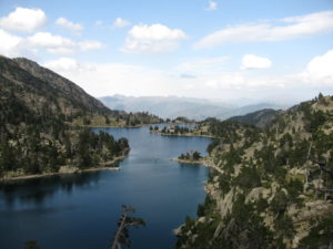 On of the many lakes in Aigüestortes i Estany de Sant Maurici National Park - with big backpacks