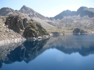 A lake with Crystal clear blue water in Aigüestortes - Finished