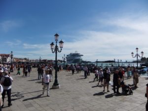 A cruise ship, so big in this small, narrow city