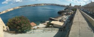 A small village on the shore below the fortress of Valletta and the bay