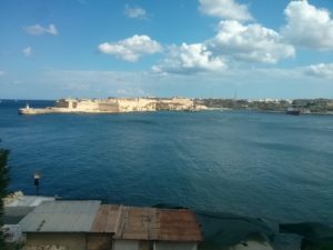 A small village on the shore below the fortress of Valletta and the bay