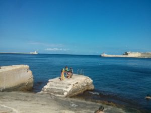 A small village on the shore below the fortress of Valletta and the bay - Malta