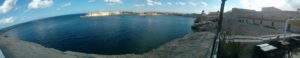 A small village on the shore below the fortress of Valletta and the bay