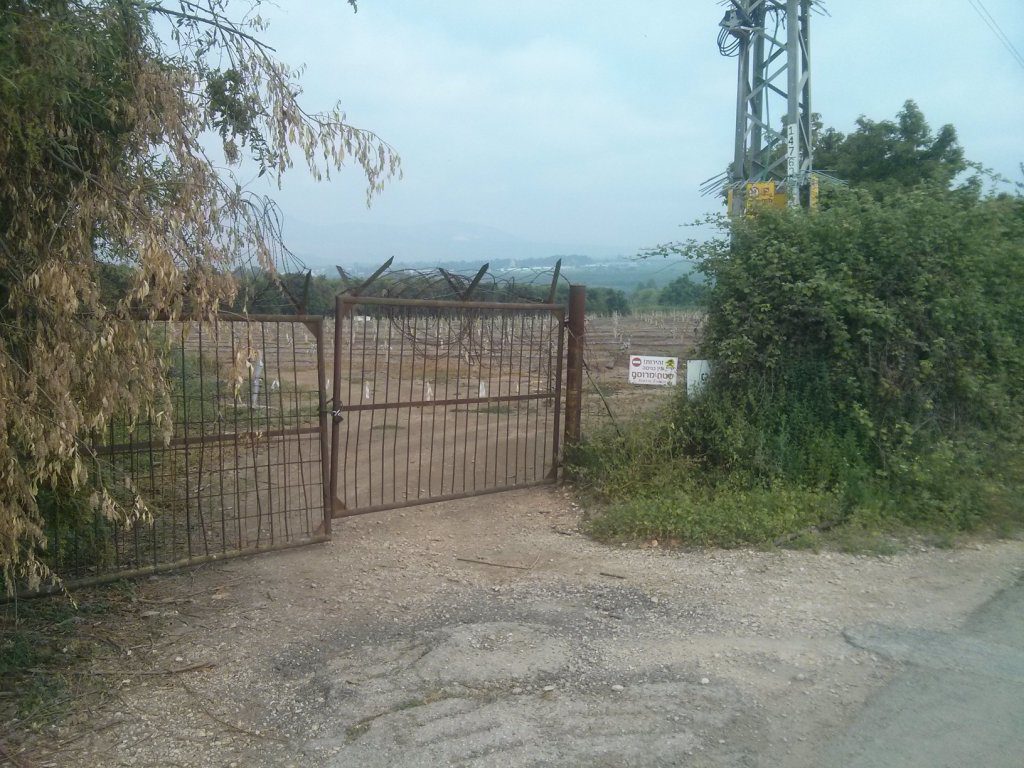 Fruit plantation near the border. What really hold ground isn't the fences but the  farmers that stay in the fields all day. That is why the fields are getting as close as possible to the border. - Windows of time1