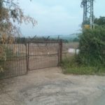 Fruit plantation near the border. What really hold ground isn't the fences but the  farmers that stay in the fields all day. That is why the fields are getting as close as possible to the border. - Windows of time1