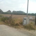 Fruit plantation near the border. What really hold ground isn't the fences but the  farmers that stay in the fields all day. That is why the fields are getting as close as possible to the border. - Windows of time2