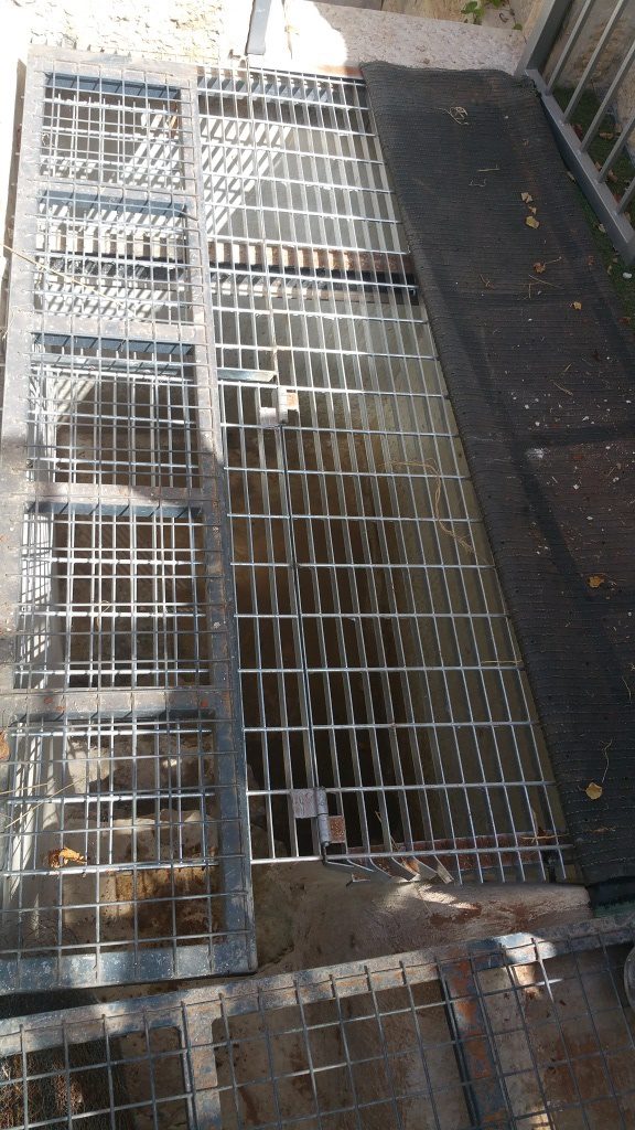 The grating on the cistern - greenhouse