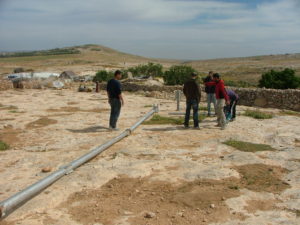 The shorter pole being installed