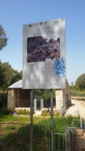 The sign about the construction of the building behind it, that will be used as a visitor center. - 7 mills