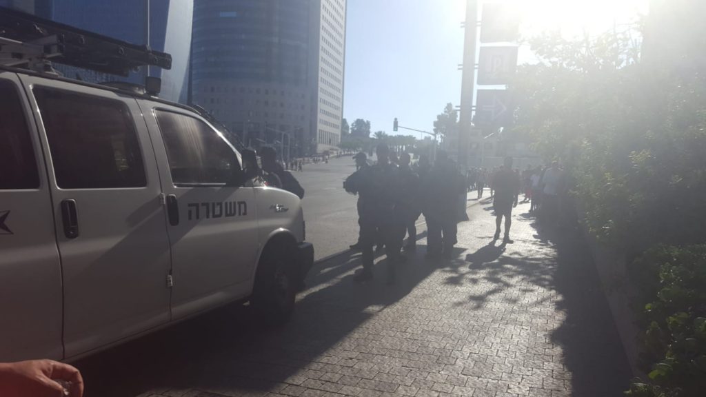 Policeman around the junction, and police tape closing the are for vehicles - Ethiopian riots