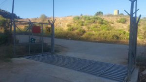 Getting in the real gate in the Neve Ativ fence. The red sign on the left says: Closed military zone!