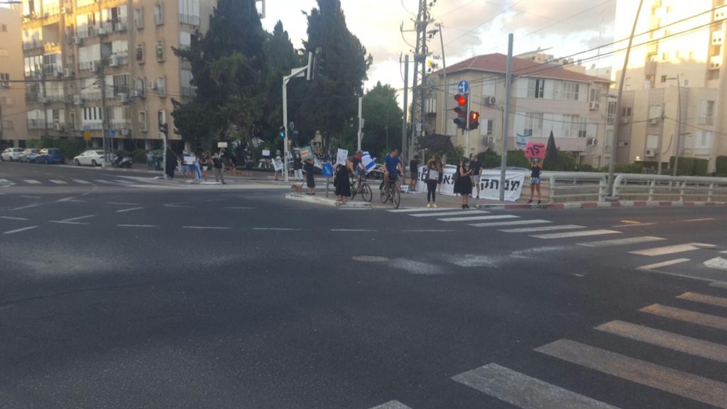 The big junction (Bialik - Aba Hillel) protest by the black flags. Still, only a km away from my house. - 1km