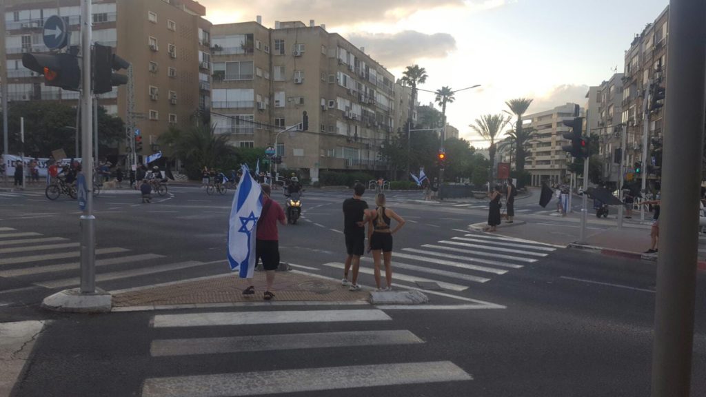 The big junction (Bialik - Aba Hillel) protest by the black flags. Still, only a km away from my house. - 1km