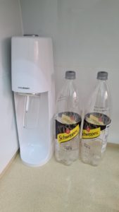 The Soda Stream machine with empty bottles we used before it