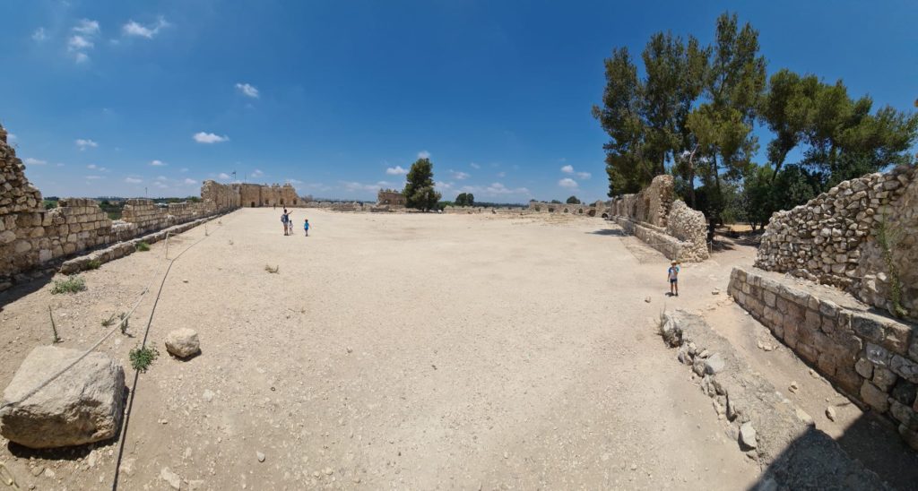 Running into Tel Afek fortress and sign at the entrance