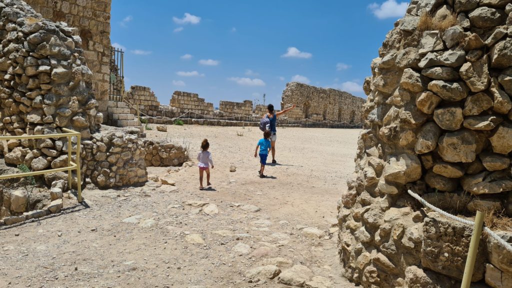 Running into Tel Afek fortress and sign at the entrance