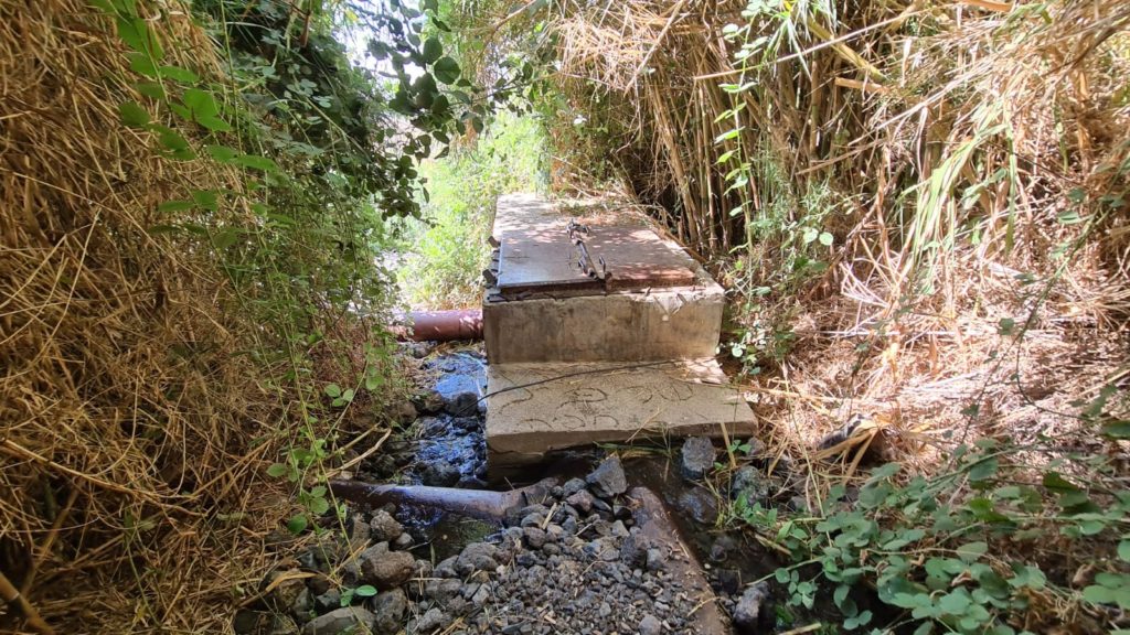 The concrete atructure that used to catch the water.