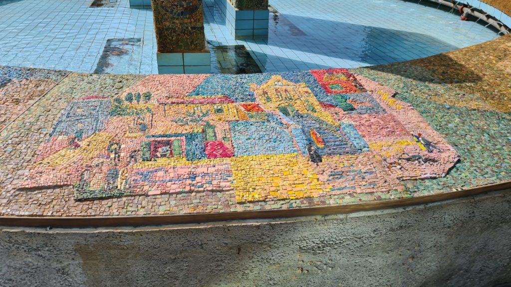 The scenes on the mosaic on the curve around the fountain