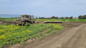 An armored D9 bulldozer and the bridge inside the firing zone - tank bridge