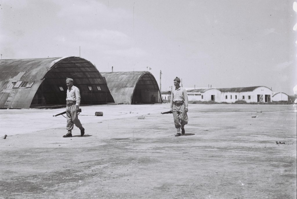 "Hagana" members guarding the former British RAF Sirkin Airport. Those buildings are probably HAS. (Source: Wikipedia.com)