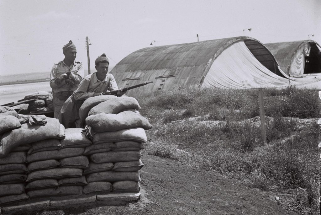 "Hagana" members guarding the former British RAF Sirkin Airport. Those buildings are probably HAS. (Source: Wikipedia.com)