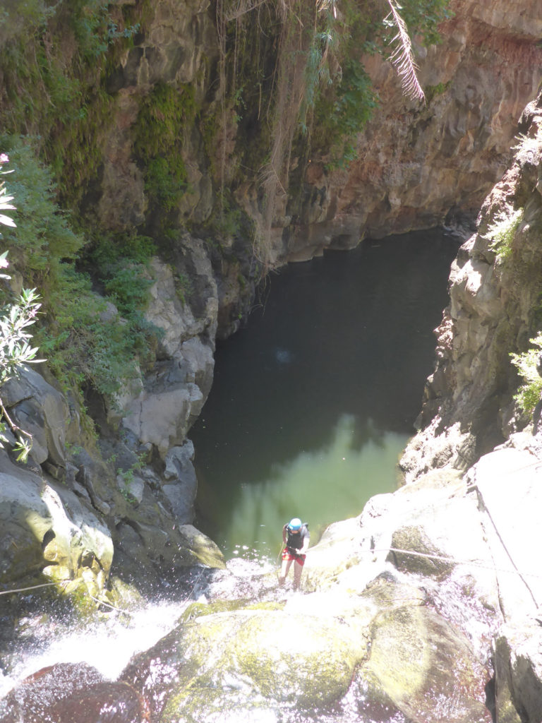 Rappelling down the third waterfall - 20m high with positive slope. On the bottom there is a 50m long pool