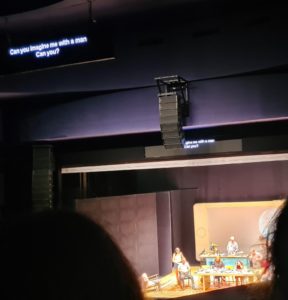 The play text was also shown as subtitiles on screen above the stage - Perfect Strangers