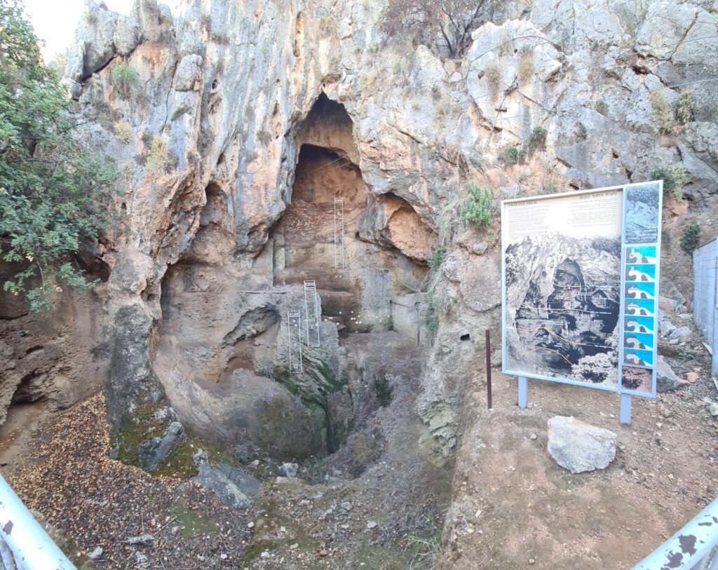 A rock hold by steel cables just above the trail - Nahal Me'arot