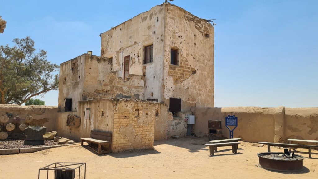 The security house which was built by the demand of the British authorities. As some of the people were policeman and had to carry weapon, it had to be kept in a secure place and not in a building made of mud.