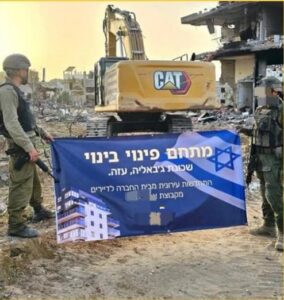 Soldiers holding a sign stating Demolish and rebuild project, Jebalia neighborhood, Gaza.