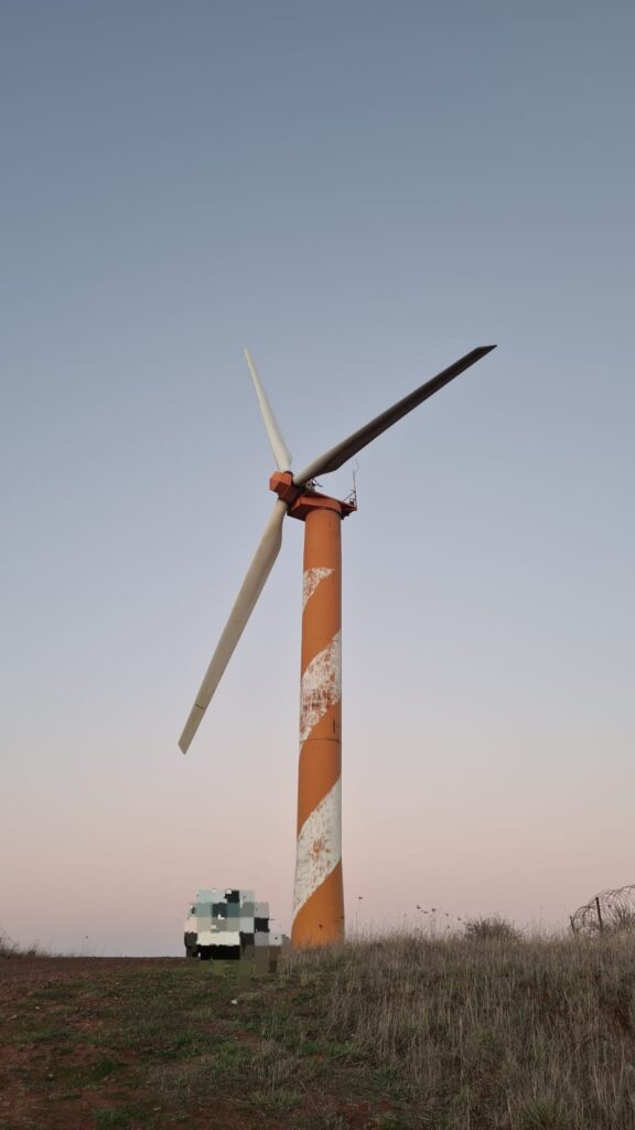 It's one of the wind turbines. We climbed another one as this one has on guardrail on the platform on top.