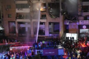 Firefighters extinguish the fire inside the apartment following the massive explosion on the southern suburb of Beirut (Source: apnews.com) - unknown 