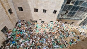 The temporary landfill that was created between the buildings,  and had been terminated since the picture was taken - garbage 