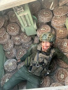 A soldier lying down in an APC full of M-29 landmines, in some point, the Engineering Corps soldiers said, the amount of explosives is so big you will evaporated - cynical 