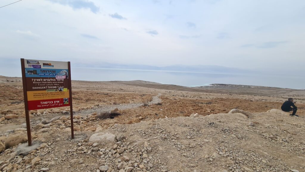 A sign warning from sinkholes in the area