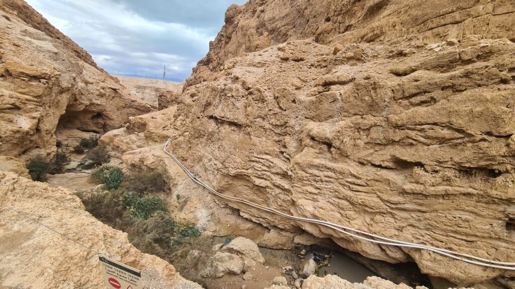 Looking on the stream flowing down to Dead Sea